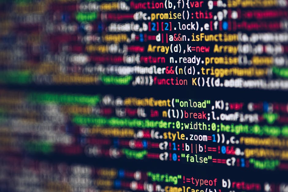 A close-up image illustrating multicolored lines of programming code on a computer screen, displaying syntax highlighting with various keywords, functions, and variables in different colors such as re